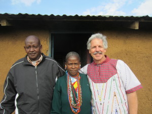 Kikanae's teacher and mentor, David Weeks, with Kikanae's parents. Kikanae's mother made the shirt that Mr. Weeks is wearing.